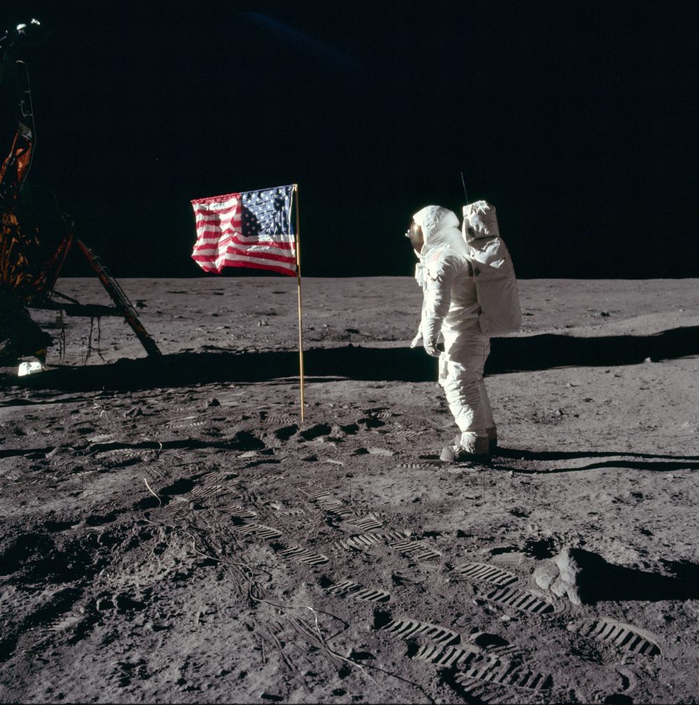 Buzz Aldrin solutes flag following Apollo 11 landing.